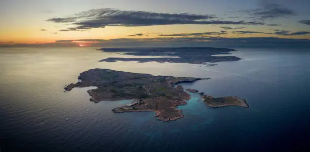 Aerial view of Malta island and Camino island, during sunrise