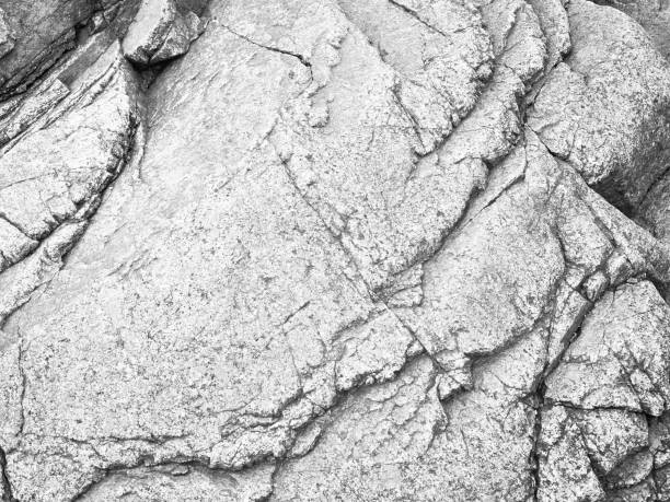 Gray natural cracked stone texture background