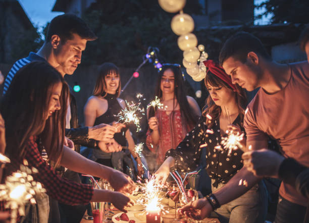 istock Group of friends having dinner party in backyard 1095640218