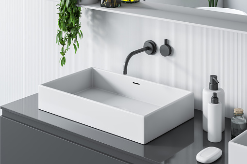 Top view of rectangular white bathroom sink standing on gray countertop in room with white walls and a mirror. 3d rendering