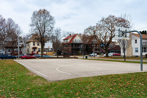 Basketball court in the Midwest free of people during autumn