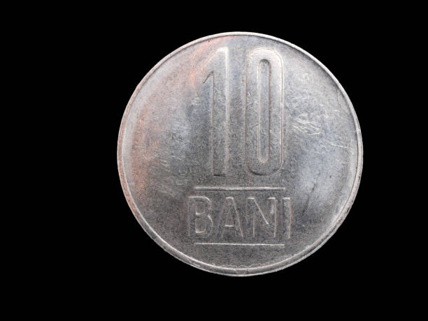 istock one romanian coin on black background 1095661650