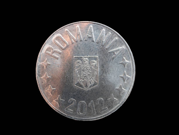 istock one romanian coin on black background 1095661654