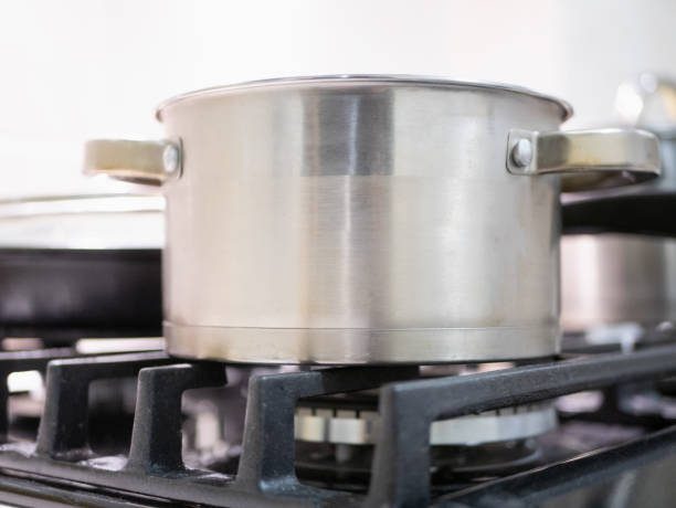 istock shiny stainless steel saucepan on kitchen stove 1095661672