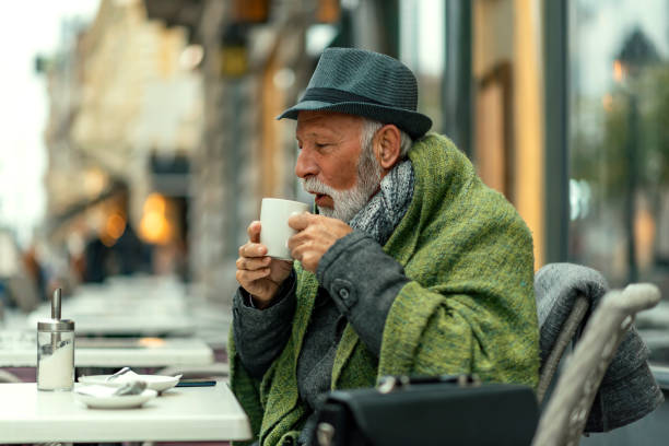istock Senior Man Drinking Tea in the City Cafe 1095669452