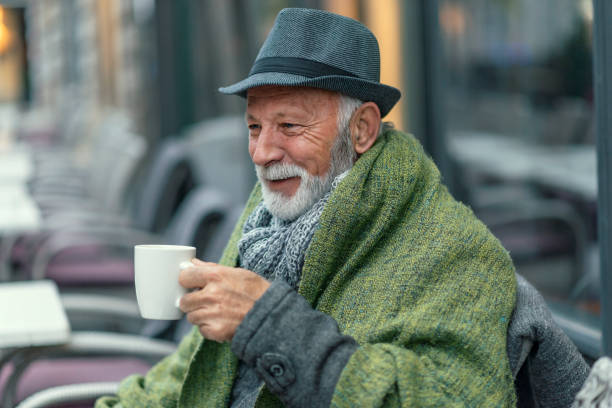 istock Senior Man Drinking Tea in the City Cafe 1095669488