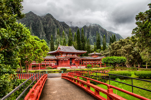 Kaneohe, Oahu, Hawaii - November 27, 2015: Japanese Buddhist Byodo-in Temple sits at the foot of the Koolau Mountains in the Valley of the Temples, which is a replica of the temple in Japan