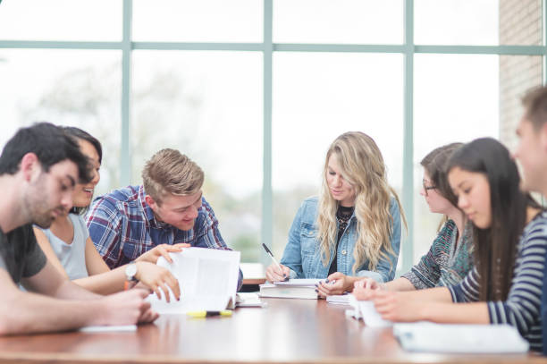 istock College students studying in the library 1095684222