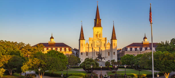 St. Louis Cathedral bathed in golden light of sunset. Jackson Square, Louisiana, United States. stock photo