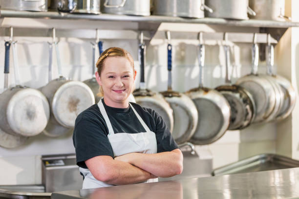 istock Woman working in commercial kitchen 1095689384