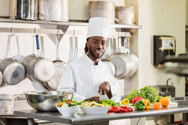 istock Chef preparing food in commercial kitchen 1095689444