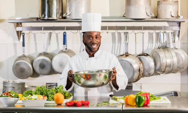 istock Chef preparing food in commercial kitchen 1095689492