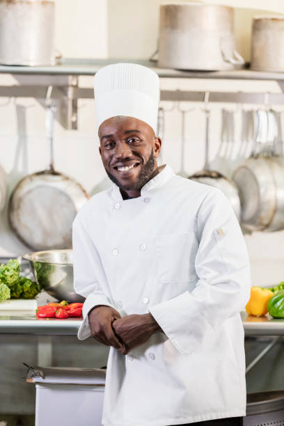 istock African-American man working as chef in restaurant 1095689582