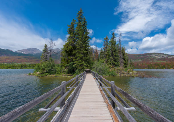 istock The Pyramid island in spring with color changing background in Alberta, Canada. 1095713514