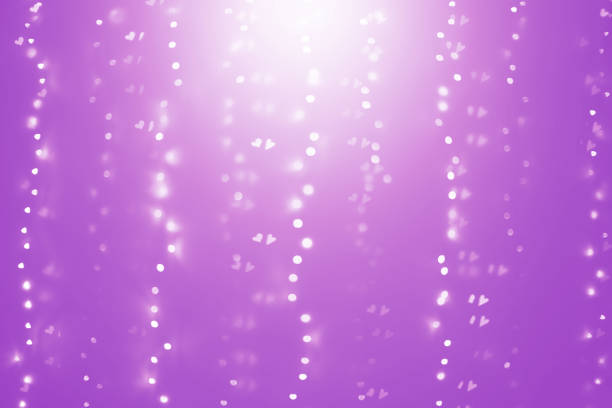 istock Shiny hearts and abstract lights background 1095719404