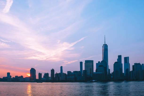 istock Sunrise over Manhattan financial district with One world trade center tower 1095719528