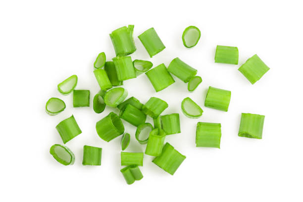 istock Chopped fresh green onions isolated on white background. Top view 1095720074