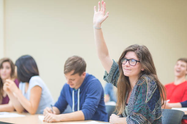 istock College students asking questions in the classroom 1095720766