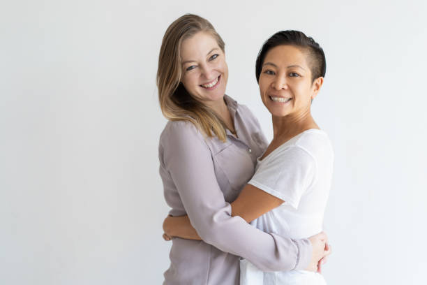 istock Happy lesbian girls hugging 1095730368