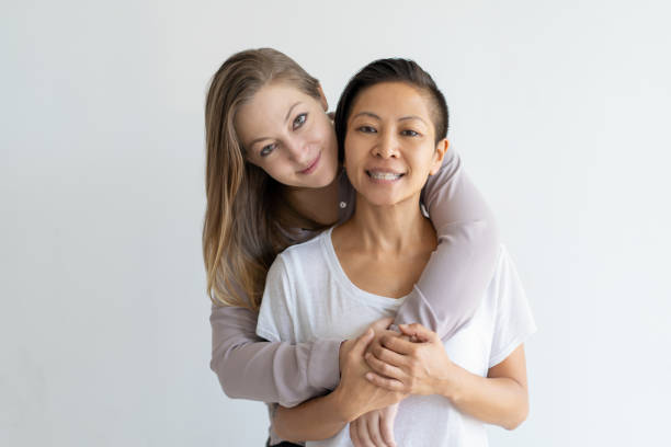 istock Positive beautiful blonde woman hugging her girlfriend 1095730384