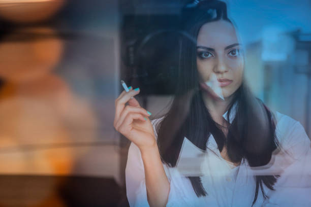 istock Girl smoking a cigarette 1095733978