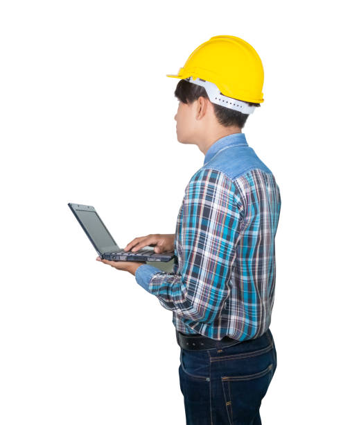 istock Engineer while holding using Laptop and head wear yellow safety helmet plastic . Concept Work construction on white background 1095740516