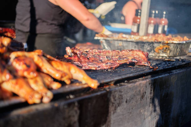 Cooking barbecue outdoor grill festival in Vancouver Cooking barbecue at outdoor summer grill festival in Vancouver canadian coin stock pictures, royalty-free photos & images