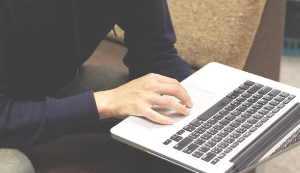 istock Close-up of man hand using laptop and typing keyboard . 1095750126