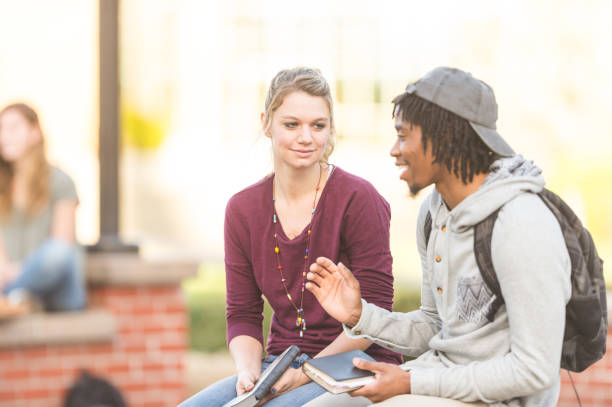 istock Two college students studying outside and reading the Bible 1095752832
