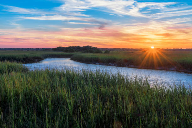 Sunset over Matanzas River in St. Augustine Sunset over marshy branch of the Matanzas River in St. Augustine, Florida florida stock pictures, royalty-free photos & images