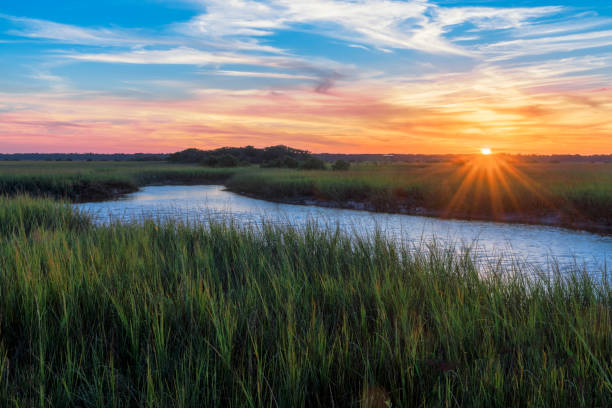 Sunset over Matanzas River in St. Augustine Sunset over marshy branch of the Matanzas River in St. Augustine, Florida sky land stock pictures, royalty-free photos & images