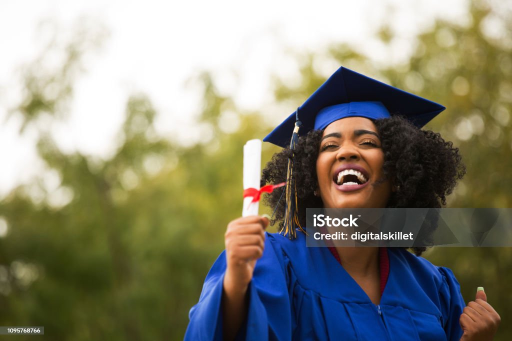 Portriat of a young African American Woman at graduation. Young African American Woman at graduation. Graduation Stock Photo