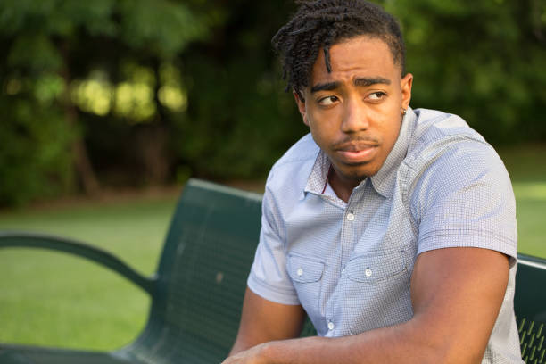istock Young African American man in deep thought. 1095772854