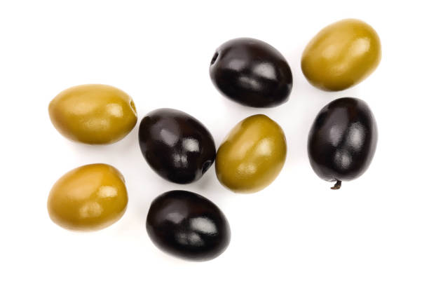 Green and black olives isolated on a white background. Top view. Flat lay.