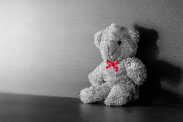 istock Teddy bear placed on wood background. 1095777058