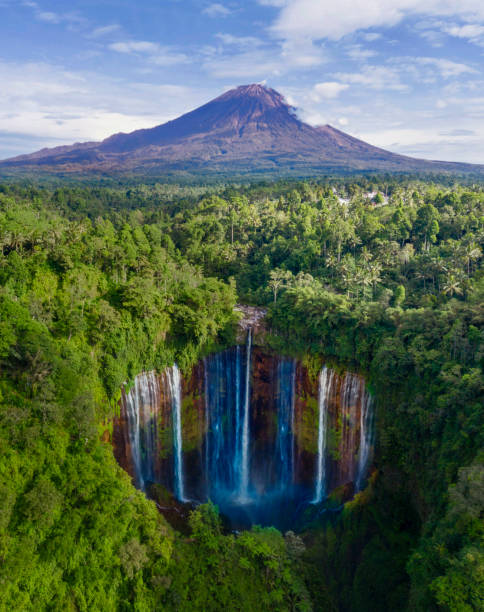 Semeru mountain with Tumpak Sewu waterfall Aerial view of Semeru mountain with Tumpak Sewu waterfall located in Lumajang, Indonesia bromo tengger semeru national park stock pictures, royalty-free photos & images