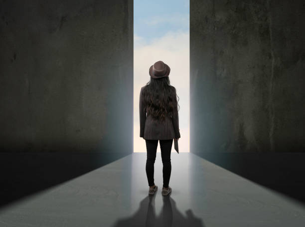 istock Woman in suite and hat looking at future 1095790924