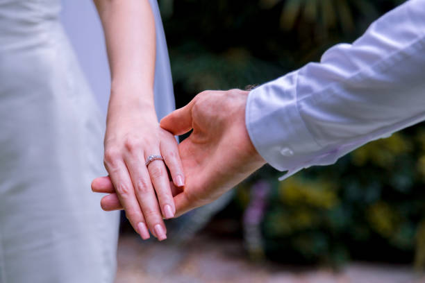 istock Bride and groom holding hands in wedding celemony. 1095795046