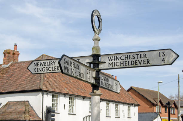 Fingerpost, Overton Finger post in the middle of the Hampshire town of Overton pointing towards the main towns and cities accessible from the now sleepy area. hampshire england photos stock pictures, royalty-free photos & images