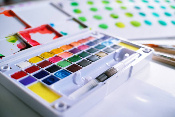 istock Watercolor paints and brushes workplace artist with artistic tools for mock up. 1095813624