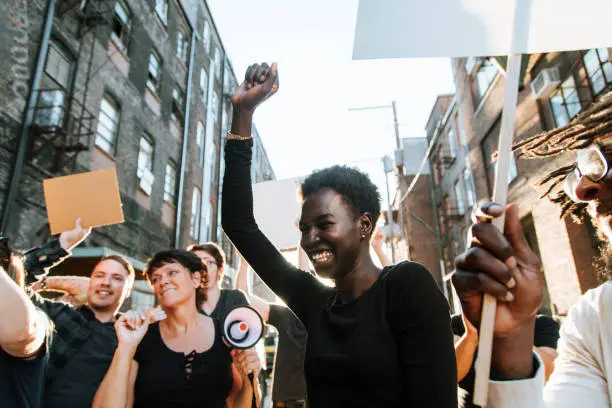 Photo of Ecstatic protesters marching through the city