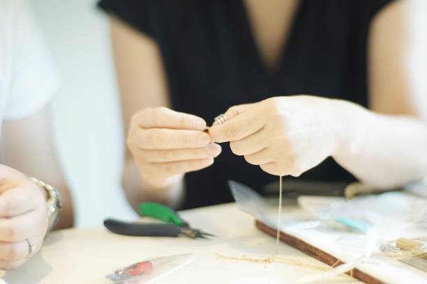 istock Women making jewelry 1095825060