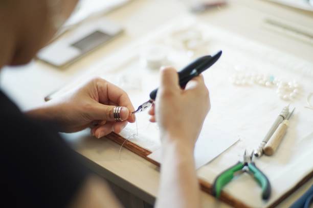 istock Women making jewelry 1095825648