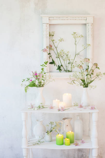 istock white vintage interior with flowers and candles 1095827164