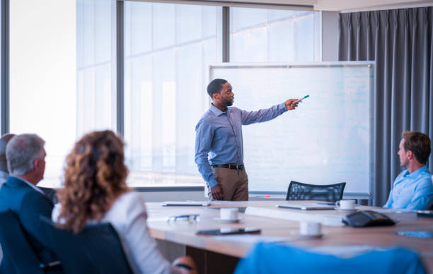istock Young businessman giving presentation in meeting 1095827244