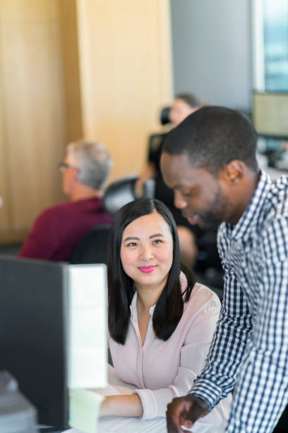 istock Multi-ethnic coworkers are discussing at desk 1095830730