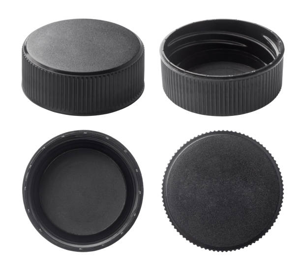 Black plastic bottle caps Black plastic bottle caps isolated on white background gasket stock pictures, royalty-free photos & images