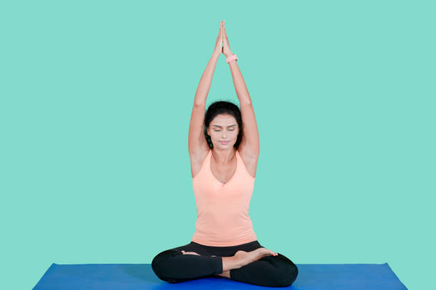 istock Indian woman doing yoga exercise in the studio 1095831084
