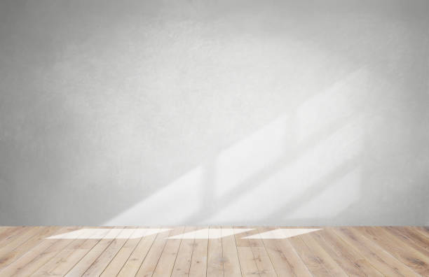 istock Gray wall in an empty room with a wooden floor 1095833136