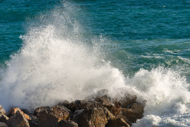 istock Sea waves break on the rocks - Liguria Italy 1095837862